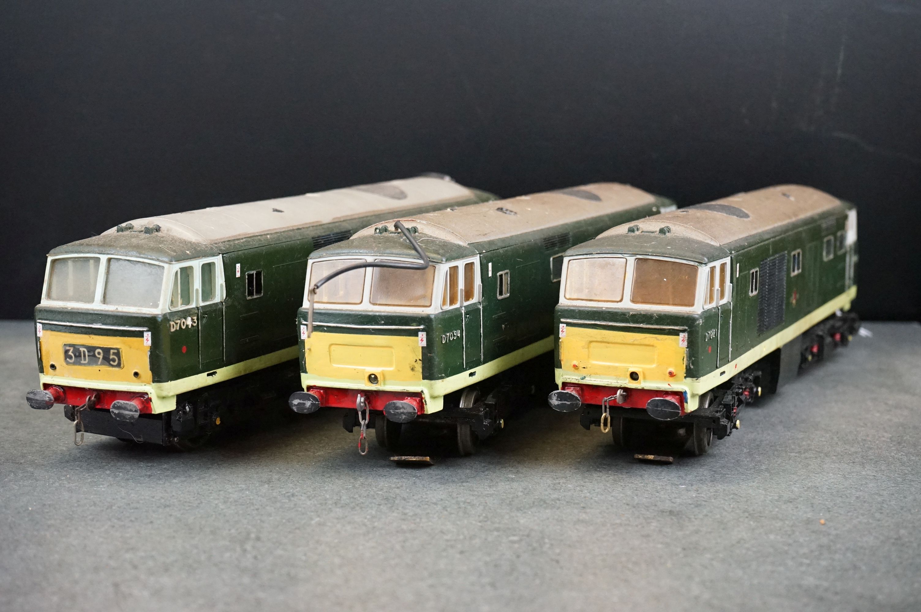 Three kit built O gauge Diesel locomotives in BR green livery to include D7043, D7054 & D7021,