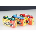 Three boxed Dinky diecast racing car models to include 242 Ferrari in red, 240 Cooper in blue and