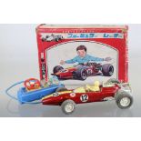 Boxed Bandai Japan R/C 7-7579 Battery Operated tin plate racing car with driver, in red, race number