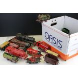 Four O gauge locomotives plus 18 x items of rolling stock, all showing heavy play wear, features