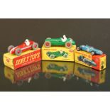 Three boxed Dinky diecast racing cars to include 240 Cooper in blue (no driver), 231 Maserati in red