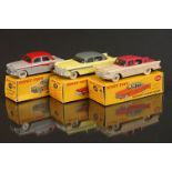 Three boxed Dinky diecast models to include 180 Packard Clipper Sedan in two tone cerise/cream (very