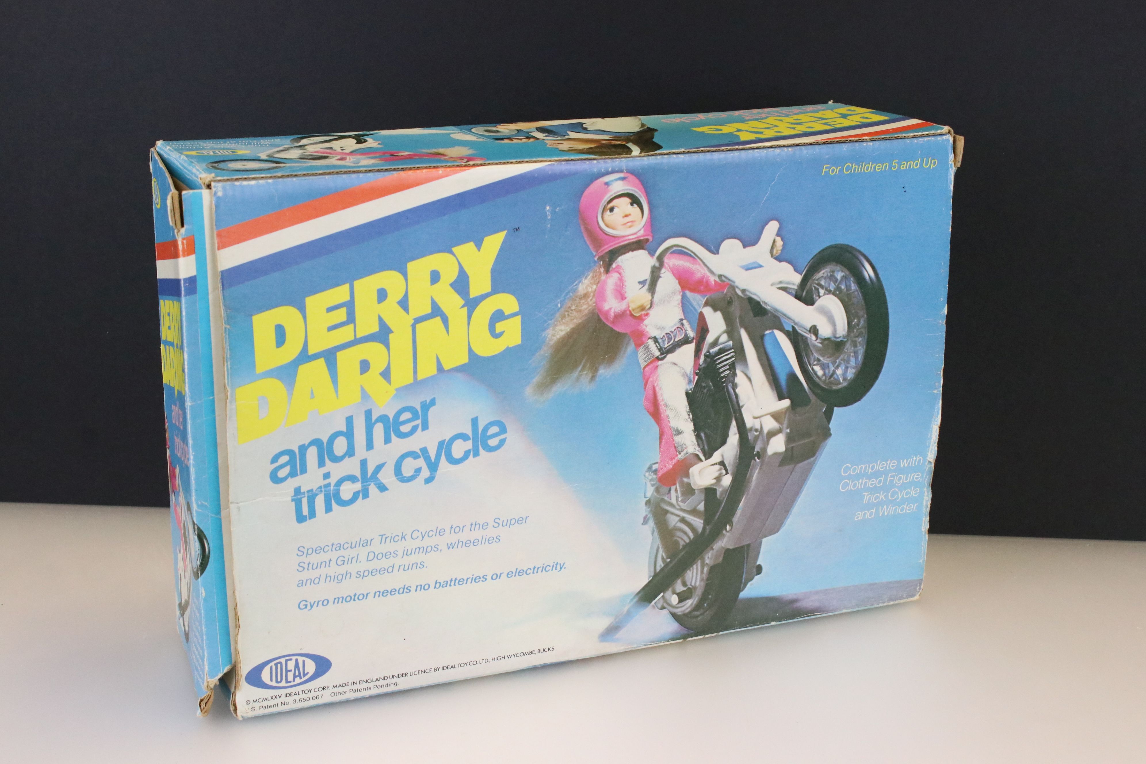 Boxed Ideal Derry Daring and Her Trick Cycle, with accessories (accessory chipped to corner), play
