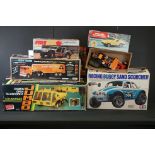 Five boxed R/C vehicles to include Einco Nikkos Heavy Trucker (complete with r/c), Latrax Alpha