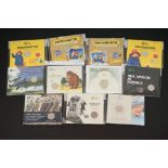 A collection of eleven Royal Mint 50p collectors coins to include Paddington, Innovation In Science,