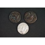 A small collection of three ancient Roman coins to include a silver example.