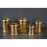 Five Brass Measure Tankards including two quart, two pint and half pint, stamped GR, tallest 15.5cm