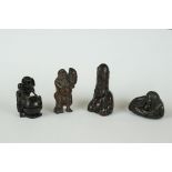 A collection of four Chinese carved wooden netsuke of figural form to include a Mermaid and a