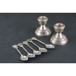 A pair of fully hallmarked sterling silver candlesticks together with a set of five teaspoons.