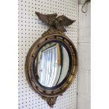 Mid 20th century Atsonea Circular Convex Wall Mirror in the Regency Manner surmounted by an eagle,