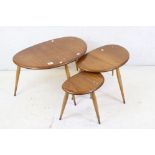 Ercol Light Elm and Beech ' Windsor No. 354 ' pattern Nest of Three Pebble Tables, largest 65cm long