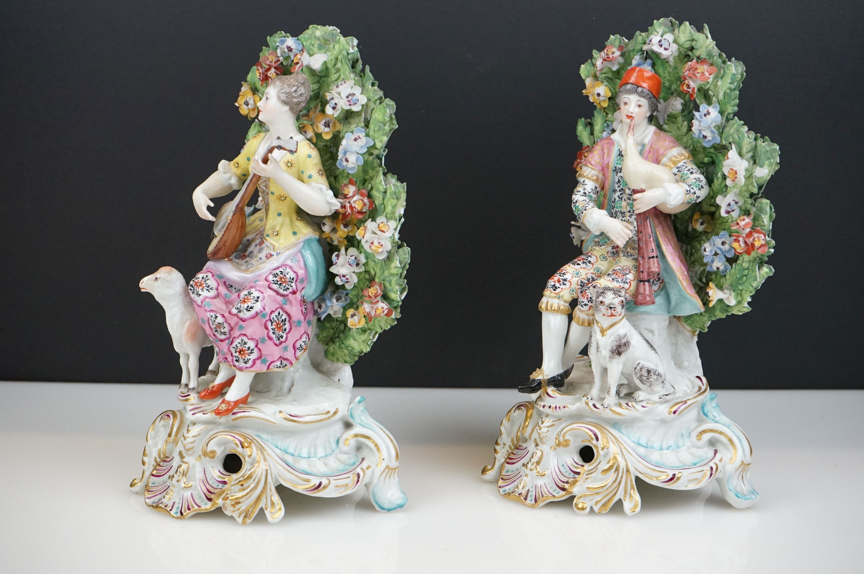 Pair of Chelsea Porcelain Bocage Figures in the form of a Man playing bagpipes with a dog and a - Image 3 of 6