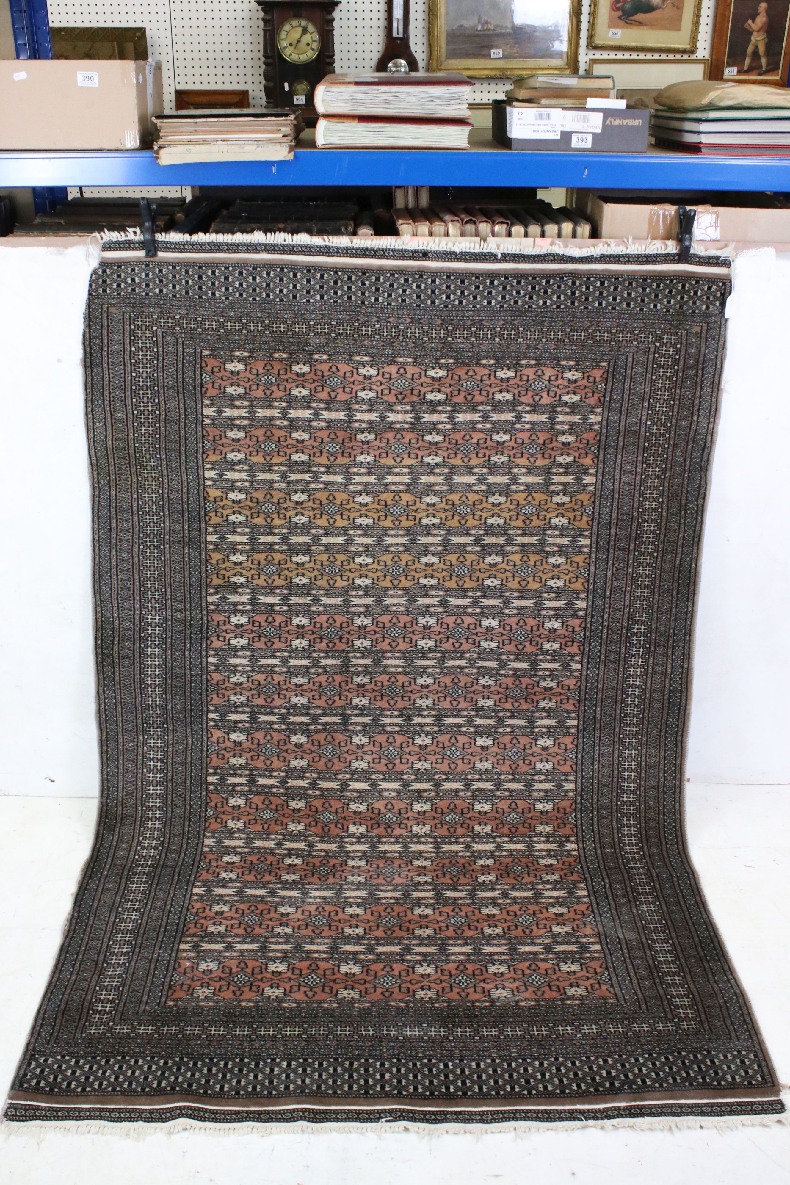 Eastern Grey and Red Ground Wool Rug with rows of geometric pattern, approx. 197cm x 126cm