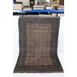 Eastern Grey and Red Ground Wool Rug with rows of geometric pattern, approx. 197cm x 126cm