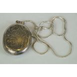 Silver photo locket of pendant form on a silver chain