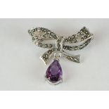 Silver and marcasite bow-shaped brooch with large amethyst drops
