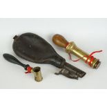 A small group of hunting collectables to include a leather powder flask, powder / shot measure and a