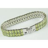 Substantial silver bracelet in the form of a double row of peridot