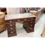 Victorian Mahogany Twin Pedestal Desk with green leather inset top over an arrangement of nine