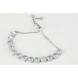 Silver and aquamarine cabochon line bracelet with size adjuster