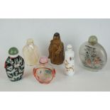 A small group of oriental collectables to include reverse painted snuff bottles and ceramic