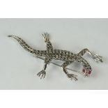 Large silver and marcasite lizard brooch with ruby eyes