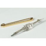 A 15ct gold tie pin together with a sterling silver Royal Navy tie pin.