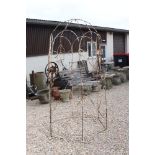 A white painted wrought iron garden Pergola, stands approx 220cm in height and approx 128cm in