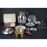 A collection of mixed silver plated items to include cutlery, dishes, toast rack..etc..