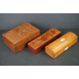 A collection of three boxes to include two wooden and a lacquer example.