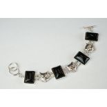 Silver bracelet, set with agates and cat mask spacers