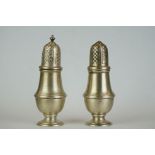 A pair of fully hallmarked sterling silver salt and pepper shakers.