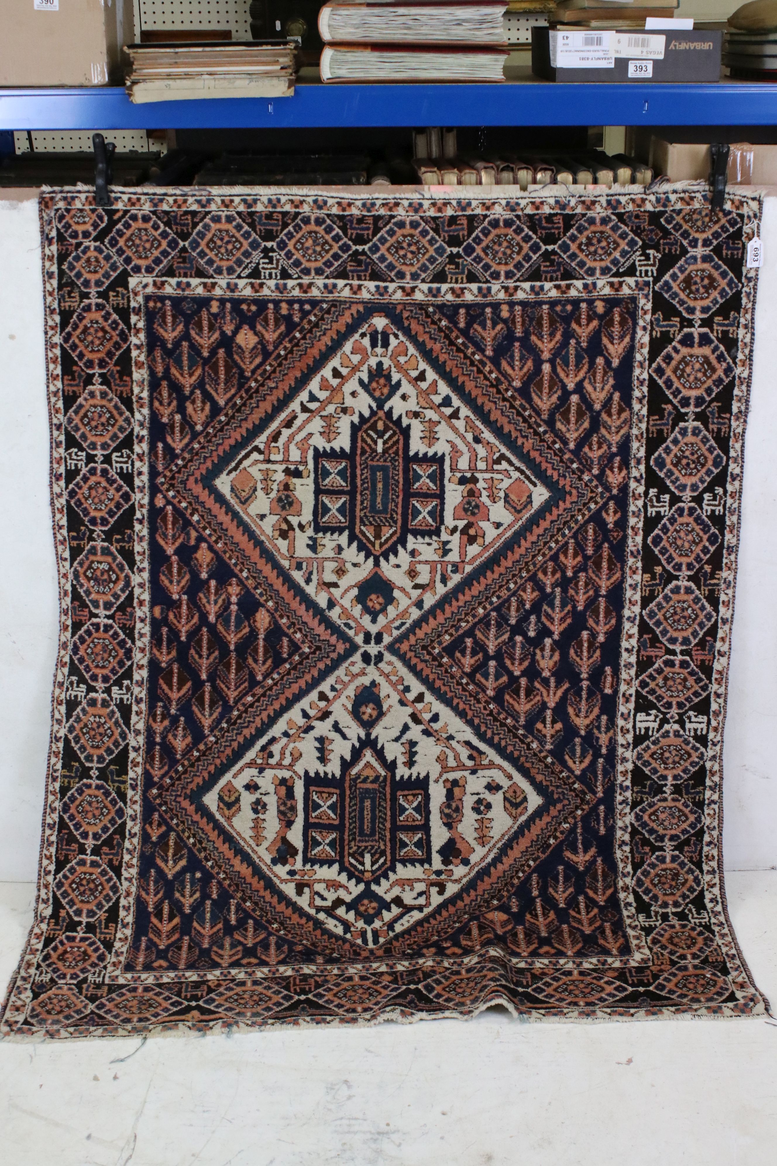 Iranian Blue and Cream Ground Wool Rug decorated with two diamonds of geometric patterns, 152cm x