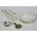 Chinese 999 silver jewellery set to include a bangle, ring, chain and pendant