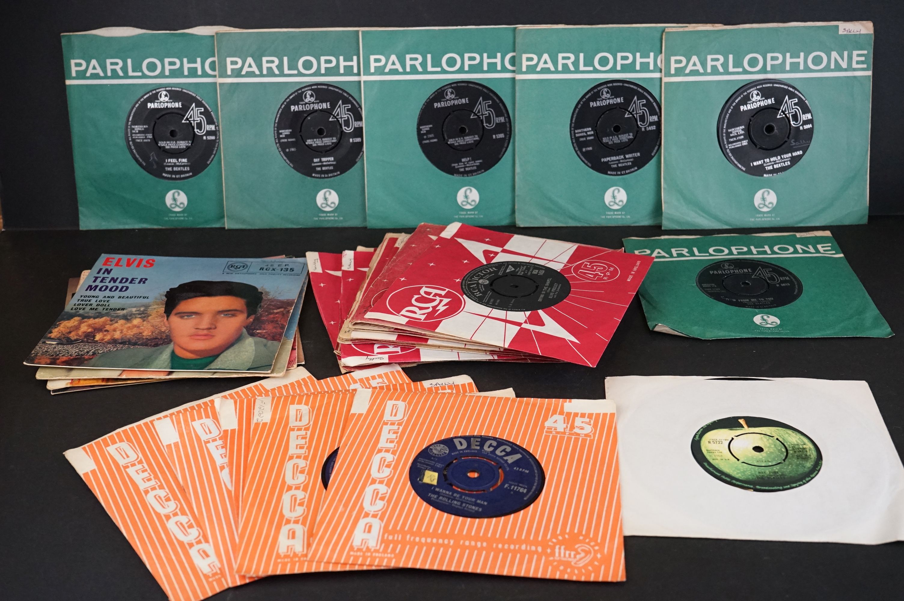 A small collection of 7" single vinyl records to include The Beatles, The Rolling Stones and Elvis