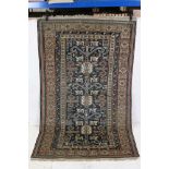 Eastern Blue Ground Wool Rug decorated with geometric patterns within a border, approx. 169cm x