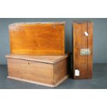 A collection of three wooden boxes with hinged lids.
