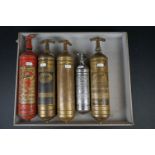 A collection of five early to mid 20th century Pyrene fire extinguishers.