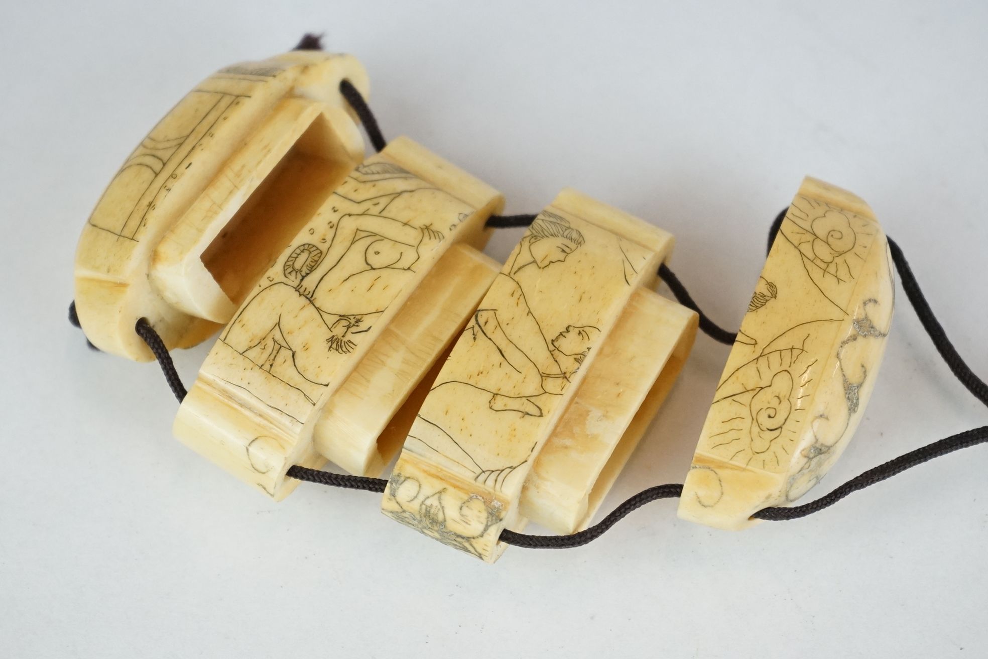 Two Japanese carved bone Inro with engraved erotic images. - Image 7 of 8