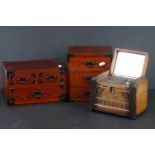 Two wooden table top collectors cabinets together with a wooden cased cigarette box.