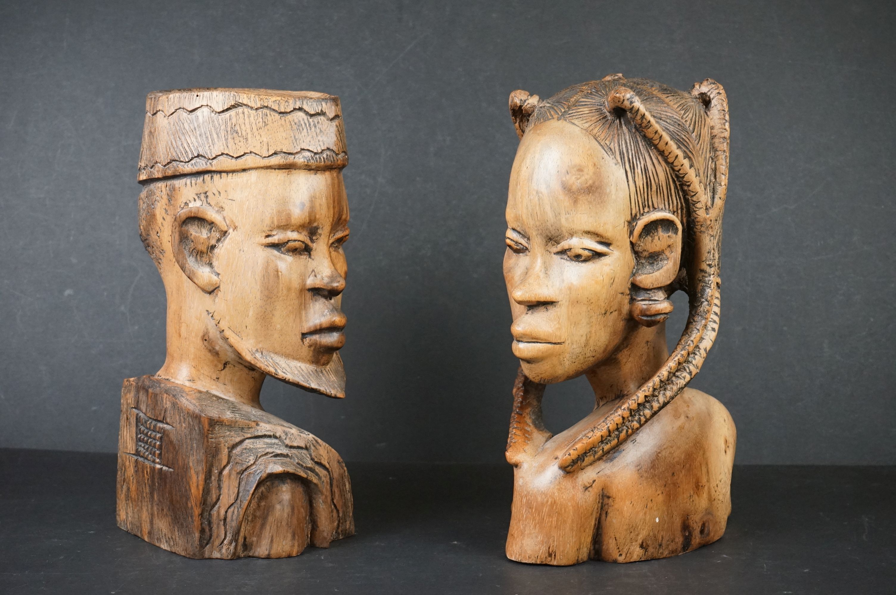 A pair of African hand carved wooden heads.
