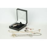 A small collection of sterling silver and gold jewellery to include a necklace and rings.