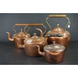 A collection of four antique copper kettle with brass fittings.