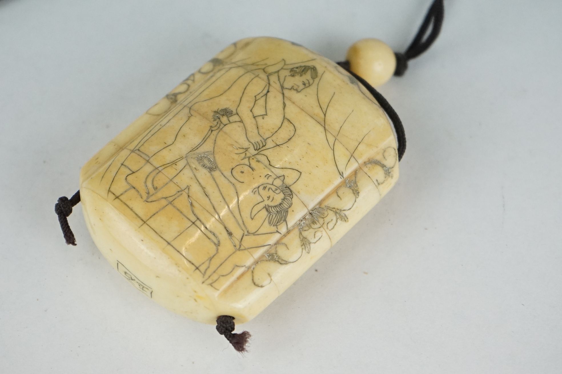 Two Japanese carved bone Inro with engraved erotic images. - Image 6 of 8