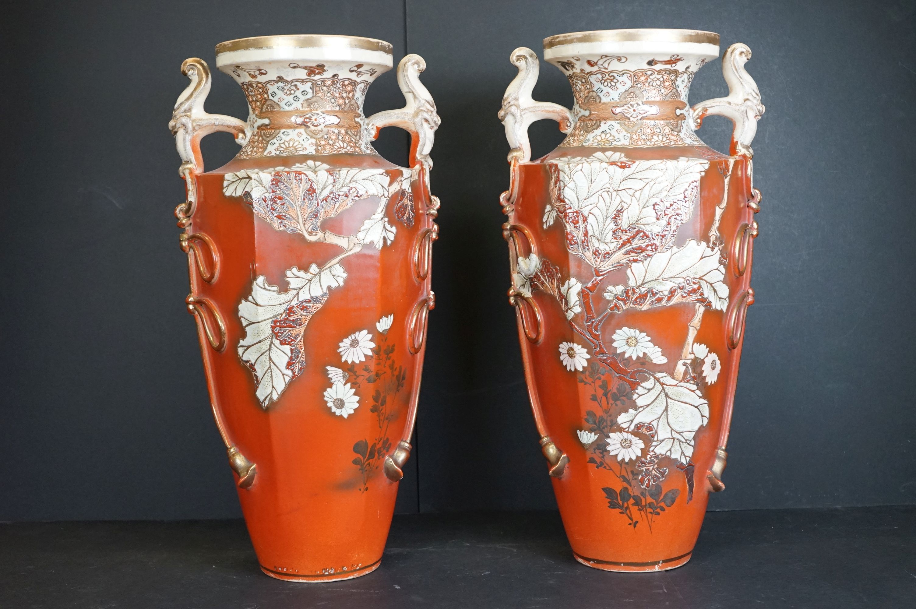 Pair of ceramic Japanese twin-handled vases with prunus decoration, signed to base