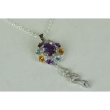 Unusual silver snake pendant necklace made up of central amethyst, citrine and aquamarines