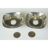 Two Indian sterling silver pin dishes each with silver one rupee coins to the centre.