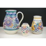 Poole Pottery Jug decorated in the HE Bluebird pattern (handle re-attached) 21cm high together