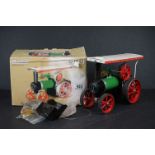 A boxed Mamod steam tractor complete with accessories.