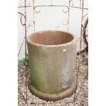 A large industrial stone pipe, suitable for use as an oversized garden planter. Stands approx 80cm
